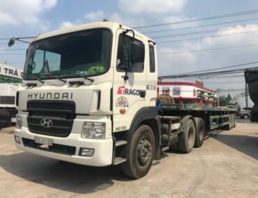 Cho thuê xe mooc sàn tại Long An chở hàng siêu trường siêu trọng – Hàng Hải VN